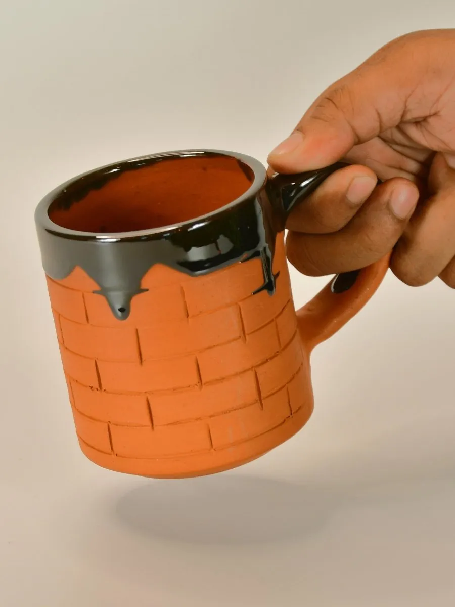 Sculpted Terracotta Coffee Mug: Stylish Functionality