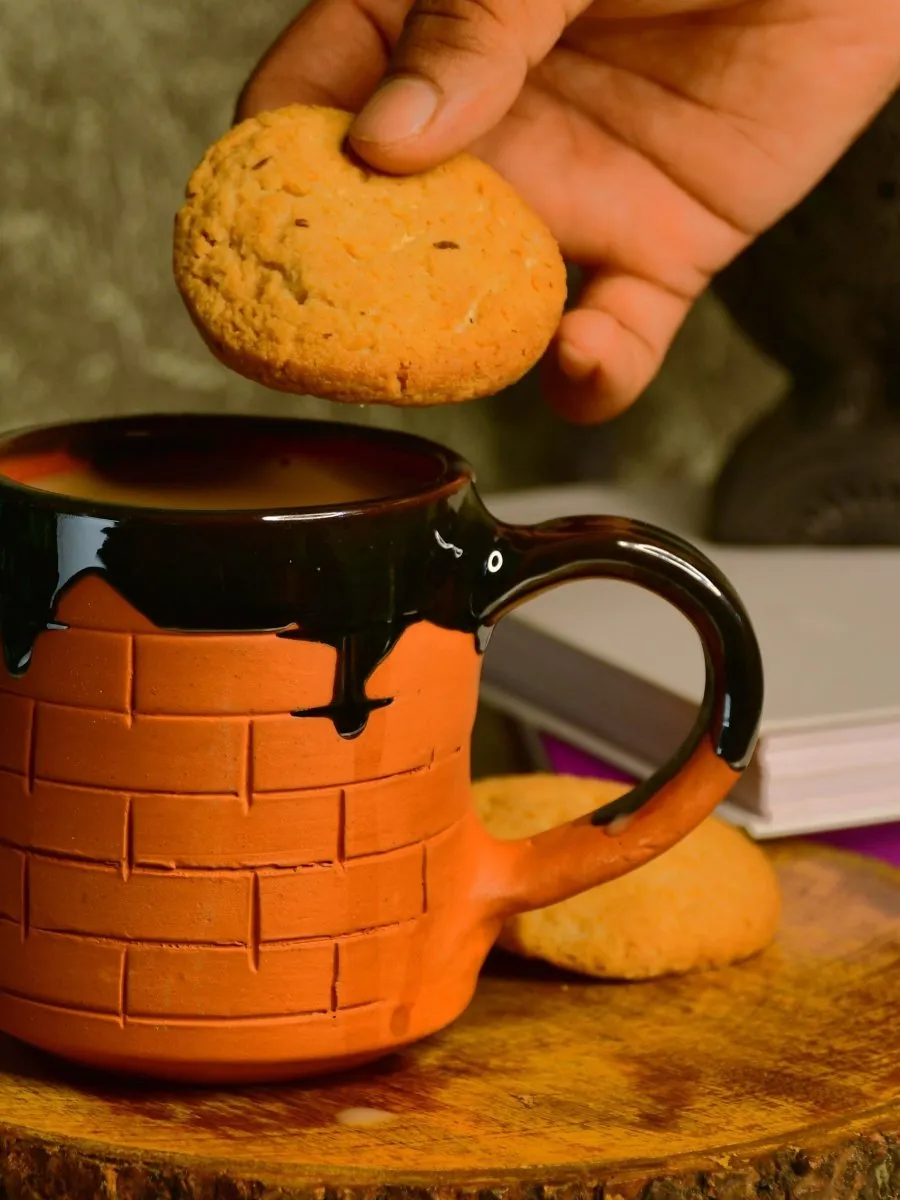 Sculpted Terracotta Coffee Mug: Stylish Functionality